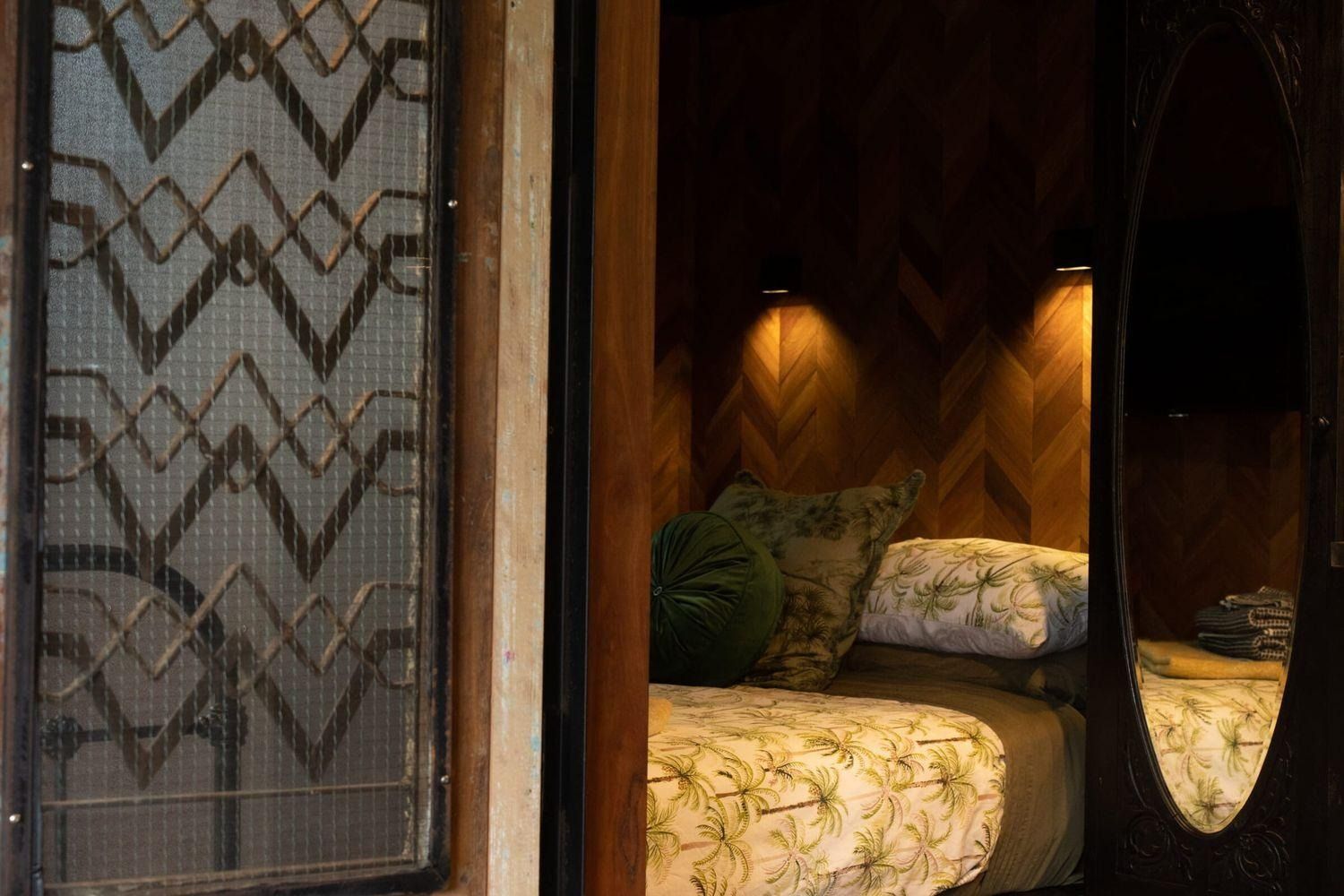 a bedroom glimpsed through the door