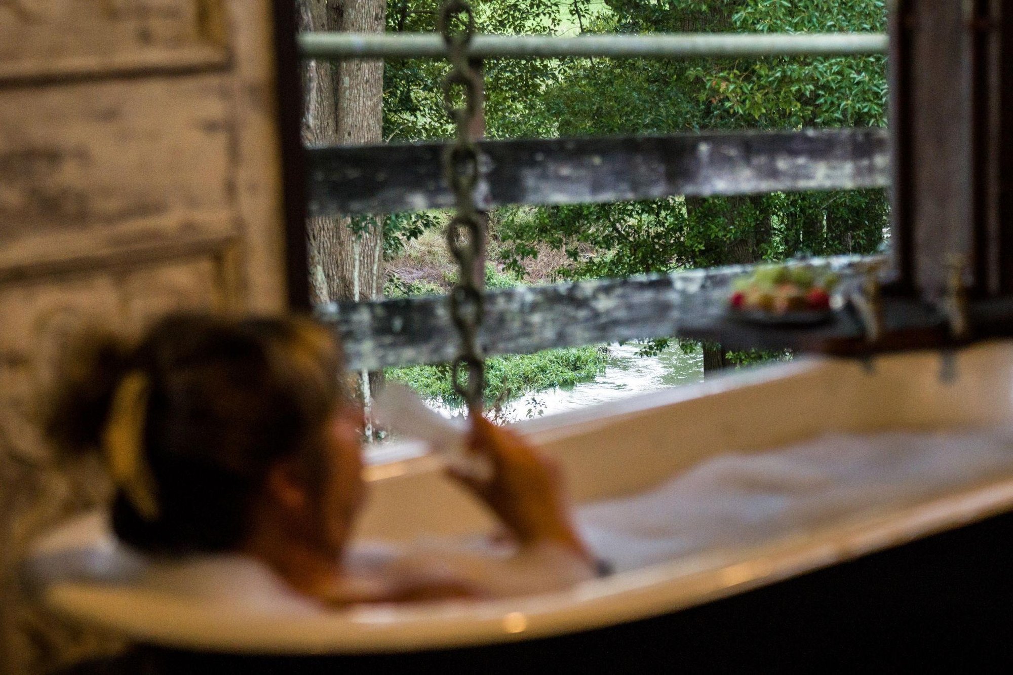 soaking in the barnita bath, creek out the window